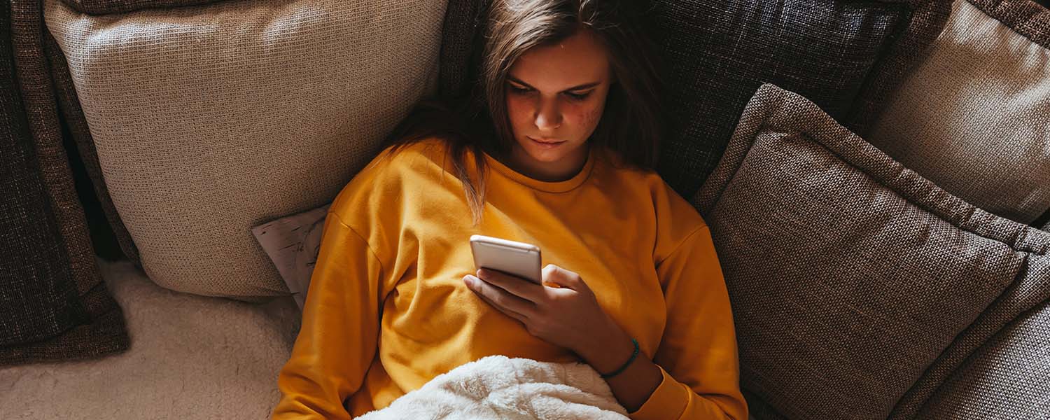 Young woman scrolling on her smartphone